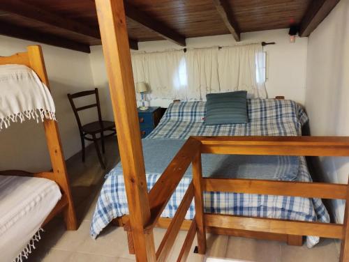 a bedroom with a bunk bed and a desk at Comodo Departamento en zona residencial in Mar del Plata