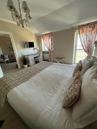 Cama o camas de una habitación en Borgo Vecchio Locanda di Charme