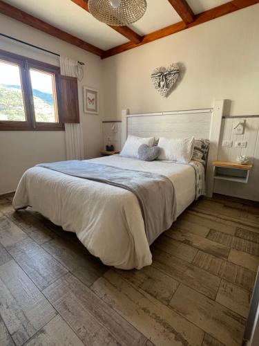 a bedroom with a large bed in a room at Casa Maeva in Tejeda