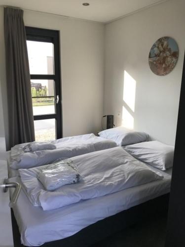Ένα ή περισσότερα κρεβάτια σε δωμάτιο στο Chalet Sonnenplätzchen Zweite Reihe Haus Nr 229