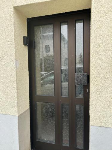 a brown door with a window on a building at Wohnung VS in Villingen-Schwenningen