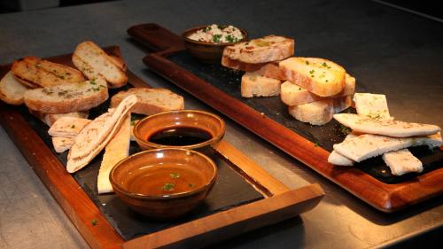 a table with two plates of food with dipping sauces at The Eccleston Hotel; BW Signature Collection in Saint Helens