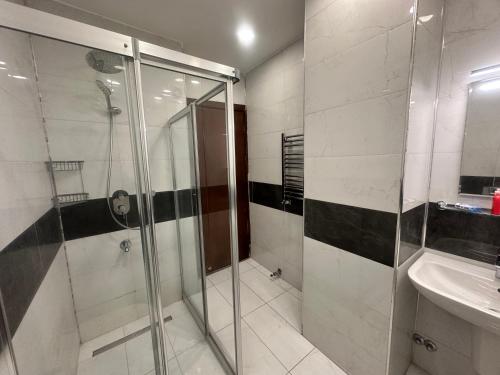 a bathroom with a shower and a sink at Adil Konak Hotel in Istanbul