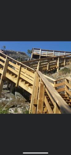 a group of wooden stairs on top of a hill at Apartamento Fazunchar in Figueiró dos Vinhos