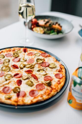 a pizza sitting on top of a table at Holiday Inn Belfast by IHG in Belfast