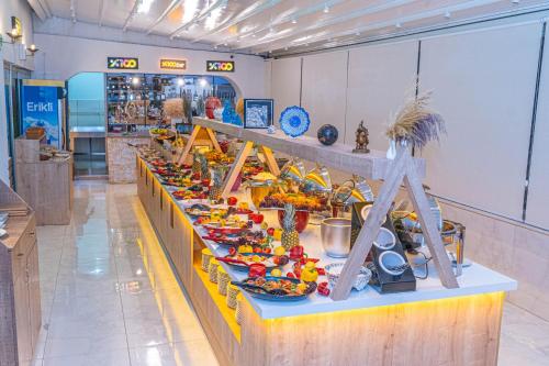 a buffet of food on a table in a store at Far Life Hotel in Antalya