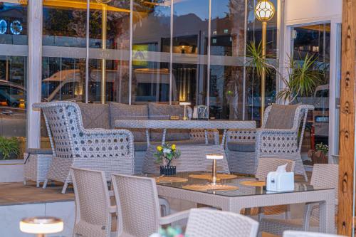 a group of chairs and tables on a patio at Far Life Hotel in Antalya