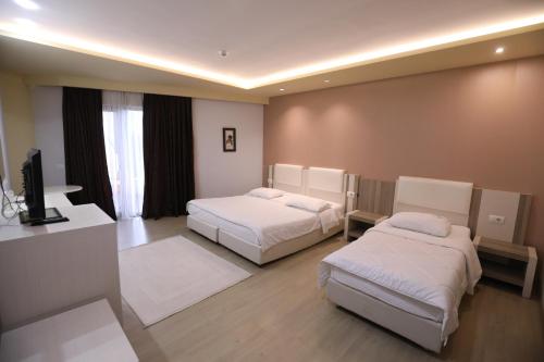 Cama o camas de una habitación en Hotel 1 Maji
