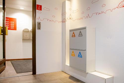 a room with a wall with letters on it at Omena Hotel Helsinki City Centre in Helsinki