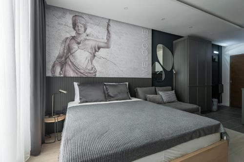 a bedroom with a bed and a painting on the wall at Marrilux apartments Residence Hill in Kopaonik