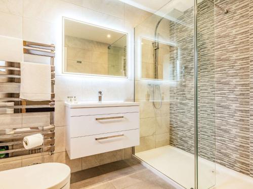 a bathroom with a shower and a sink and a toilet at 1 Bed in Sherborne 87916 in Bradford Abbas