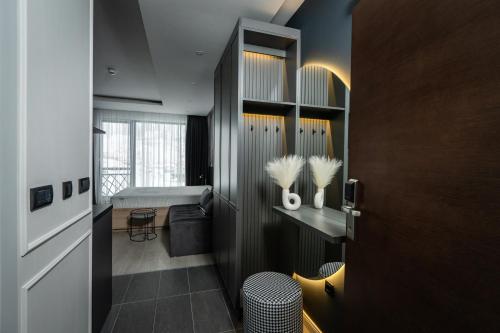 a small room with a room with a bed and a door at Marrilux apartments Residence Hill in Kopaonik