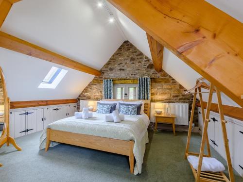 a bedroom with a bed in a attic at 2 Bed in Crickhowell 42920 in Llangattock