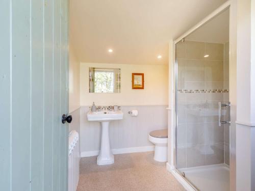 a bathroom with a shower and a sink and a toilet at 1 Bed in Easton 56742 in Kirklinton