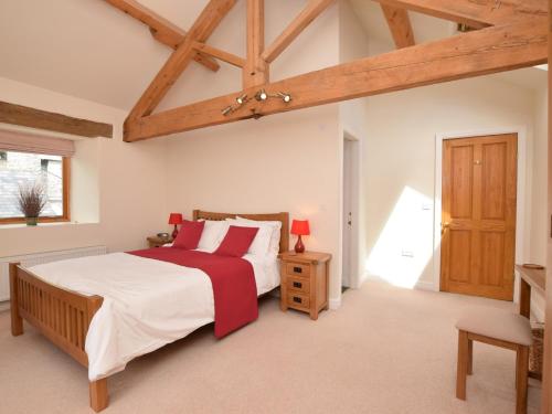 a bedroom with a large bed and a wooden ceiling at 3 bed in Cressbrook 57037 in Cressbrook