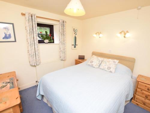 a bedroom with a white bed and a window at 1 Bed in Bradwell PK849 in Bradwell