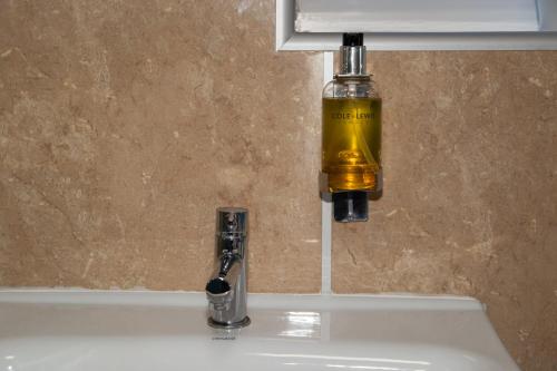 a soap dispenser on top of a sink at North Bay Cabin 1 Bedroom Apartment Near The Beach in Scarborough