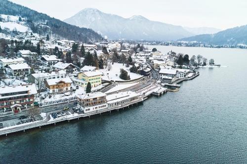 an aerial view of a town next to a body of water at Clubhaus Bachmair Weissach in Tegernsee