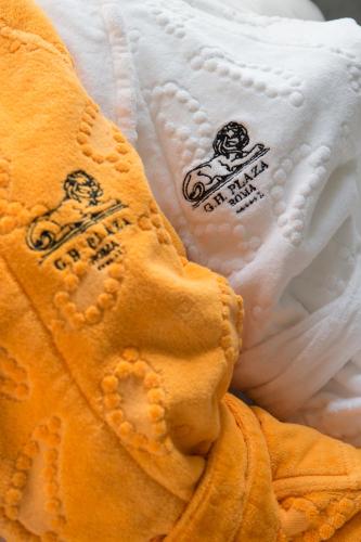 a close up of a towel with stickers on it at Grand Hotel Plaza in Rome