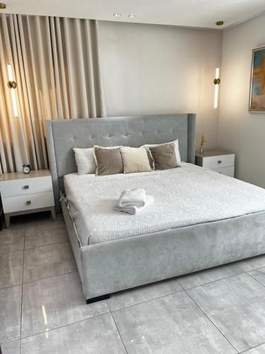 Ένα ή περισσότερα κρεβάτια σε δωμάτιο στο SOHA SUITES II