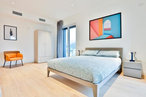 Postel nebo postele na pokoji v ubytování Porta di Mare Exclusive Seaview Terrace Flat