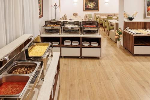 a buffet in a restaurant with many different foods at Green Wood Hotel & Spa in Bansko