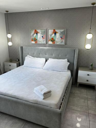 Ένα ή περισσότερα κρεβάτια σε δωμάτιο στο SOHA SUITES II