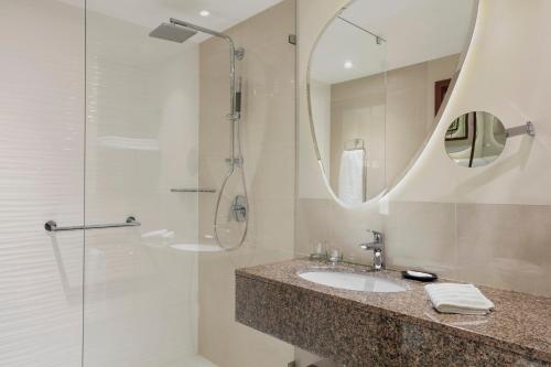a bathroom with a sink and a shower at The Westin Warsaw in Warsaw