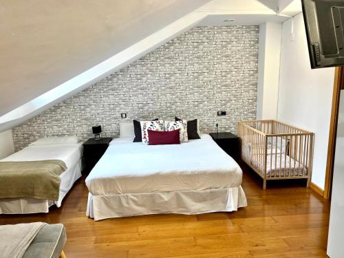 Ένα ή περισσότερα κρεβάτια σε δωμάτιο στο Apartamentos San Antonio