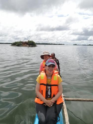 two people in a boat on the water at Hotel Lake Park in Polonnaruwa
