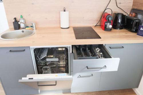 Kuchyň nebo kuchyňský kout v ubytování {Le Factory}, proche EuroAirport