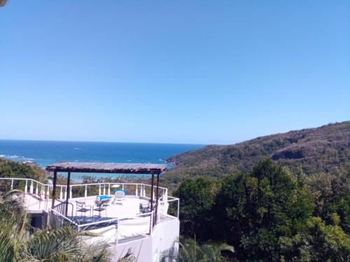 a view of the ocean from a house at Spring Hotel Bequia in Port Elizabeth