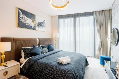 Postel nebo postele na pokoji v ubytování Livbnb - Luxury 1 BR in Address Beach Residences