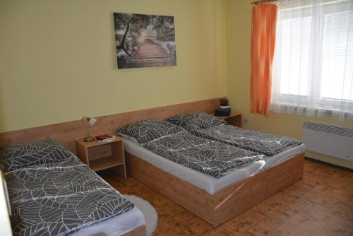 Postel nebo postele na pokoji v ubytování Chata Bystřička