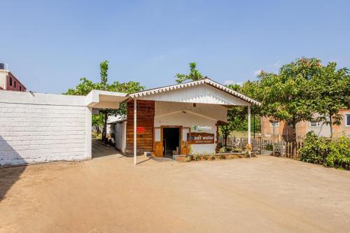 a gas station with a building at Treebo Trend Salt Water Beach Resort in Dapoli