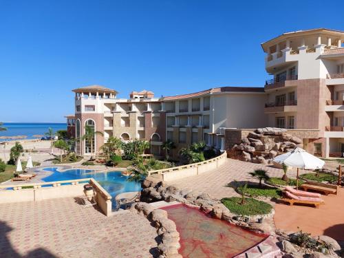 a view of a resort with a swimming pool at Royal Beach Private Apartments Hurghada in Hurghada