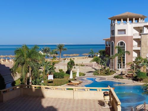 a view of the beach from the balcony of a resort at Royal Beach Private Apartments Hurghada in Hurghada