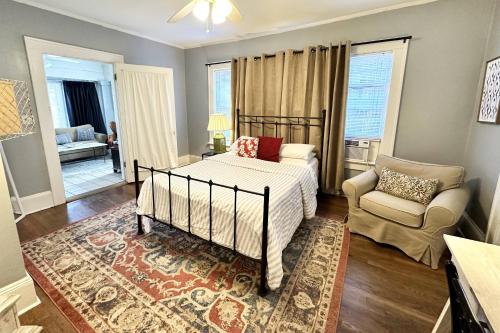 a bedroom with a bed and a couch and a chair at 1266 Monroe Drive 1 in Atlanta