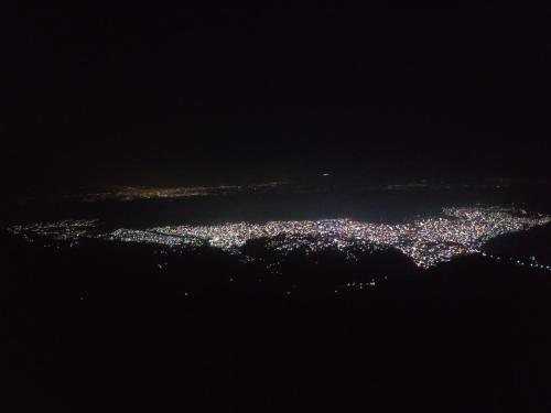 an aerial view of a city at night at TEC Resort and bar in Dharān Bāzār