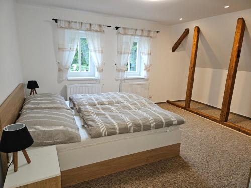 Una cama o camas en una habitación de Chata Sára
