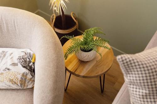 a table with plants on it next to a chair at Sur les bords de Marne - Disneyland Paris in Lagny