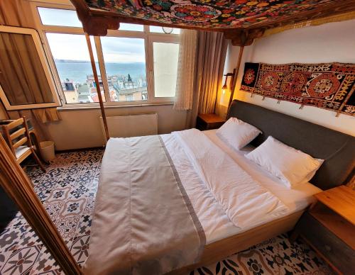Ένα ή περισσότερα κρεβάτια σε δωμάτιο στο Marmara Guesthouse
