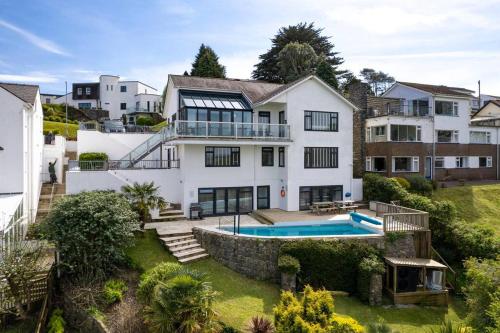 an aerial view of a house with a swimming pool at Stunning Property Seaviews, Private Pool & Parking in Saundersfoot