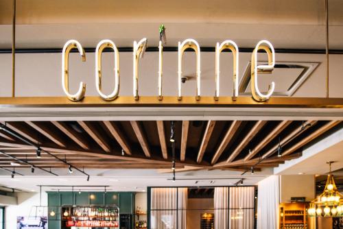 a sign for the colos restaurant in a store at Le Meridien Denver Downtown in Denver