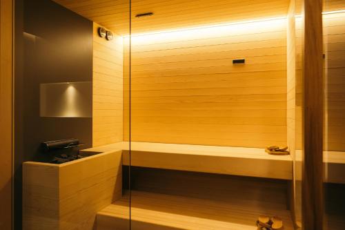 a bathroom with a shower with a glass door at Amiata Suite in Abbadia San Salvatore