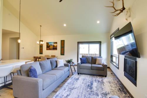 a living room with a couch and a flat screen tv at Pet-Friendly Bozeman Home about 7 Mi to Downtown! in Bozeman