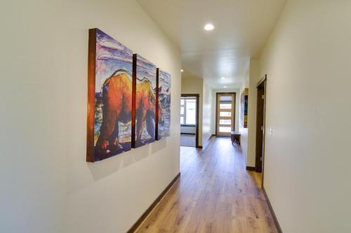 a hallway with paintings on the walls of a house at Pet-Friendly Bozeman Home about 7 Mi to Downtown! in Bozeman