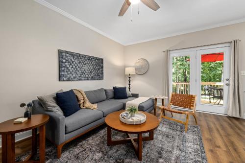 a living room with a couch and a table at The Junction House - Near Downtown Cary & RDU in Cary