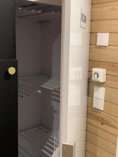 a walk in closet in a room with a door at Villa Auroras Kettu in Syöte