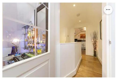 a room with a pharmacyacistacistacistacist at 4 Bed Flat - Sleeps 14 - Parking - Game Room -Wifi in London